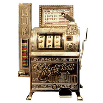 An early brass Bell-Fruit Gum slot machine with a side gum-dispensing column and reels showing fruit and ‘GUM’ symbols — the gum-payout workaround that put fruit on the reels.